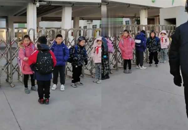 小学生在校门外等上学时遇到了零下5度的寒冷